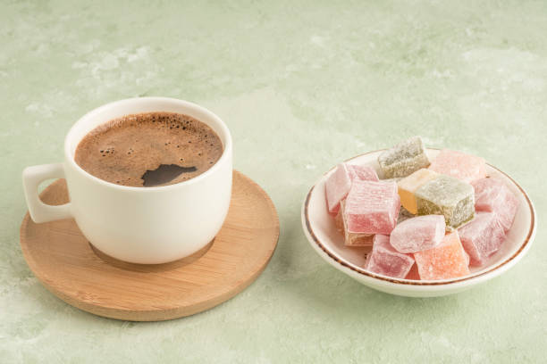 istock Turkish delights and coffee on green with copy space 1220102083