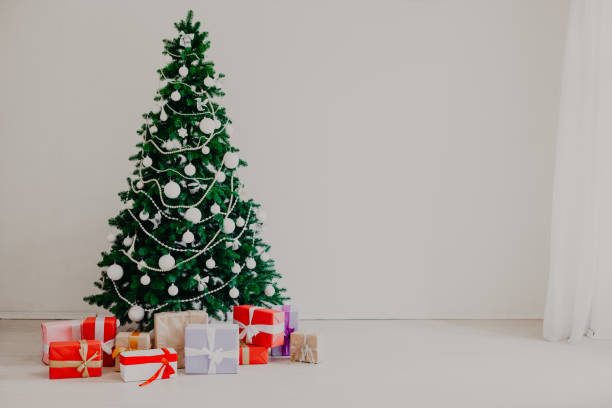 istock Christmas tree with presents in winter for the new year 1220102469