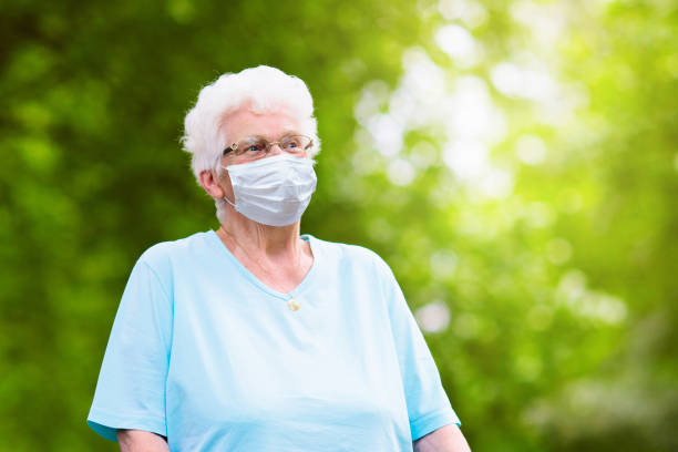 istock Senior woman in face mask. Virus outbreak. 1220103352