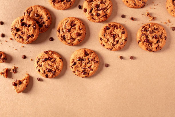 istock Chocolate chip cookies on a brown background, shot from the top with a place for text 1220103793