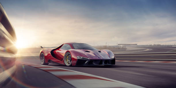 общий красный спортивный автомобиль движется на высокой скорости на ипподроме - motor racing track фотографии стоковые фото и изображения