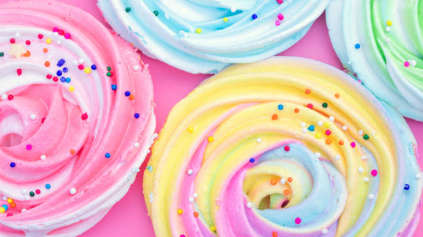 istock Colorful meringue lollipop on a pink background. 1220105540