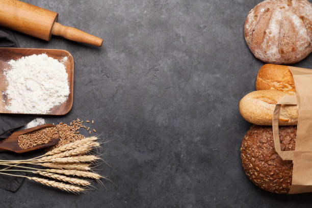 istock Various bread with wheat, flour and cooking utensils 1220106942