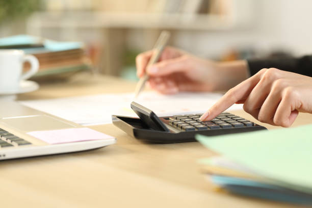 istock Entrepreneur hands calculating with calculator 1220107711