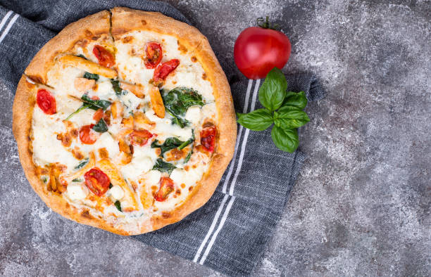 istock Italian pizza with tomato, mozzarella and chicken 1220110112