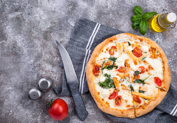 istock Italian pizza with tomato, mozzarella and chicken 1220110116