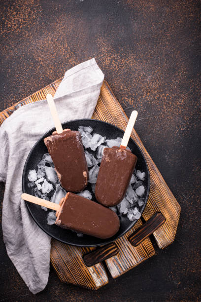 istock Chocolate ice cream popsicles in glaze 1220110160
