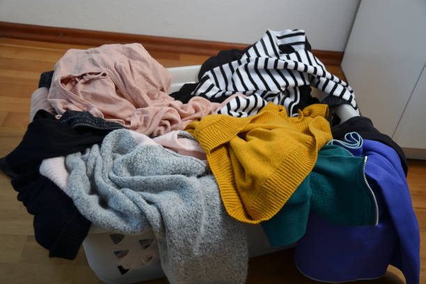 istock a laundry basket full of clothes 1220110254
