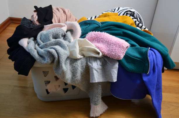 istock a laundry basket full of clothes 1220110405