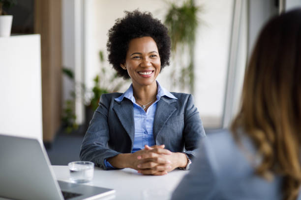 istock Two diverse businesswomen talking working together in office 1220111703