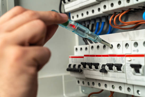 Electrician testing fuse box Electrician testing fuse box. Photo is taken in studio environment with Sony A7III camera power line photos stock pictures, royalty-free photos & images