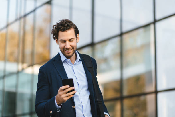 istock Young businessman typing text message on his way to work 1220113257