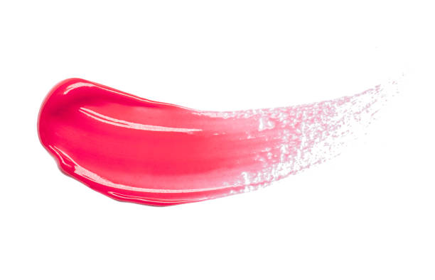 Pink purple dark red shimmering lip gloss on white background stock photo