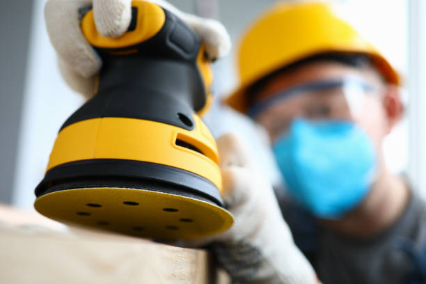 istock Man in gloves working on renovation 1220116194