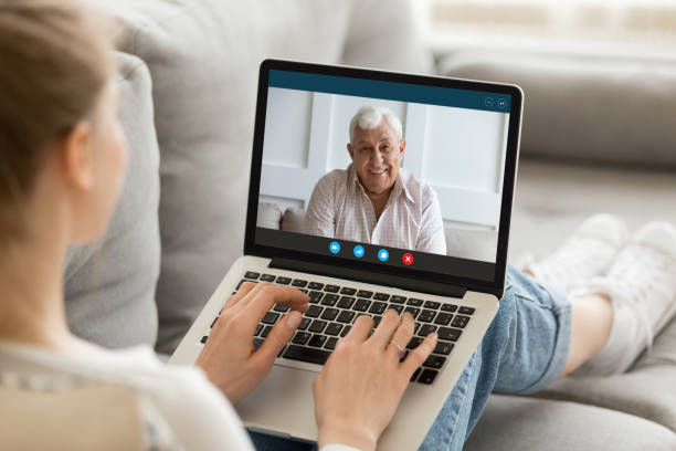 istock Young woman talk on video call with smiling parent 1220117736