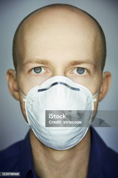 Closeup Portrait Of Man Wearing Protective Mask Against Virus And Pollution Stock Photo - Download Image Now