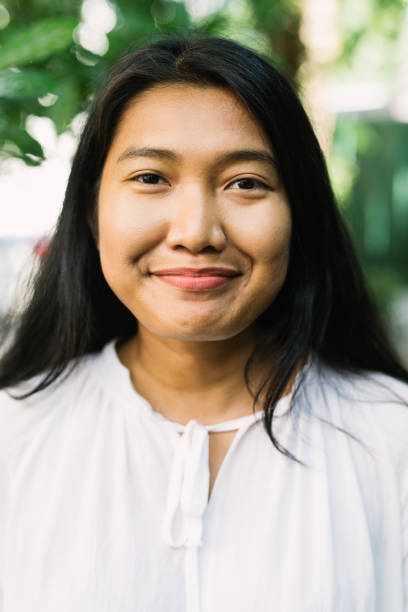 istock Young Asian Woman Smiling 1220118517