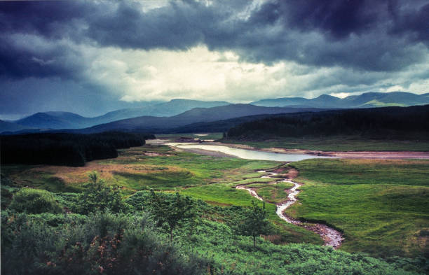 Very distinctive, characteristic landscape and weather in the Cairngorm Mountains, Scotland Very distinctive, characteristic landscape and weather in the Cairngorm Mountains, Scotland. Photo was made near Roughburn, along A86 and River Spean in foreground cairngorm mountains stock pictures, royalty-free photos & images