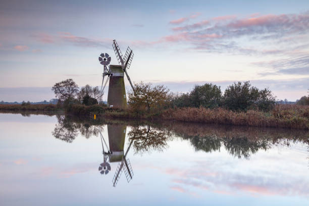 istock Sunrise around Turf Fen Mill in the Norfolk Broads. 1220121977