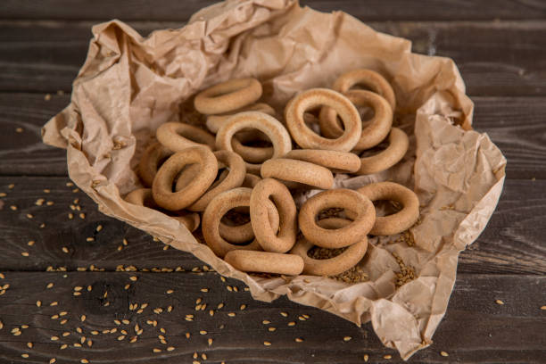 Small golden bagels in craft paper