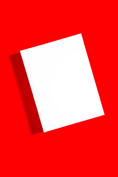 istock Mockup of closed blank square book at white textured paper 1220122091