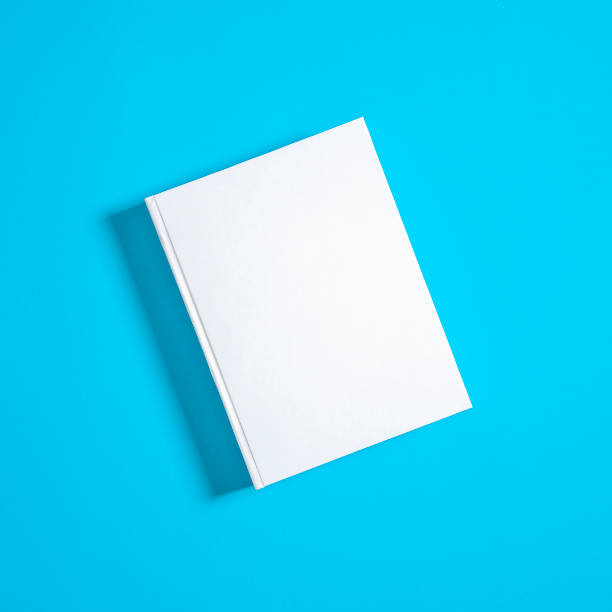 istock Mockup of closed blank square book at white textured paper 1220122131