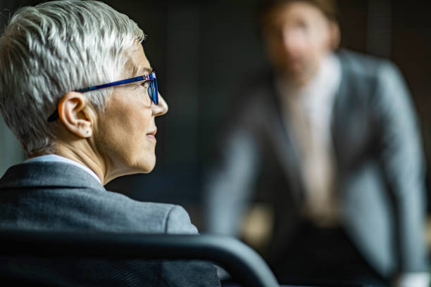 Thoughtful mature businesswoman in the office.