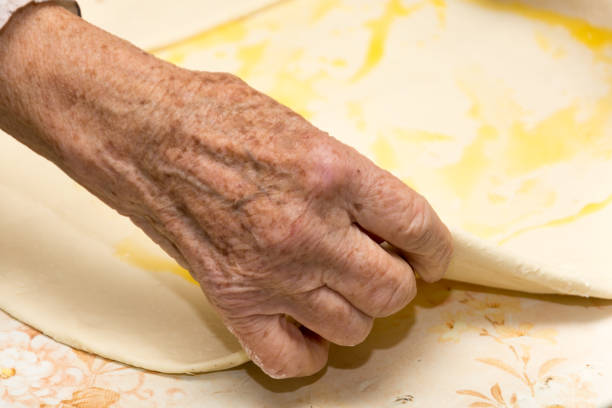 istock Grandmother making puff pastry 1220123926