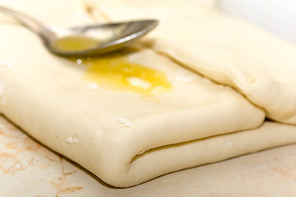 istock Spoon with margarine on the dough 1220123998