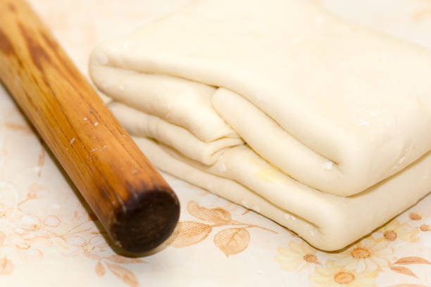 istock Cutting puff pastry for frying 1220124051