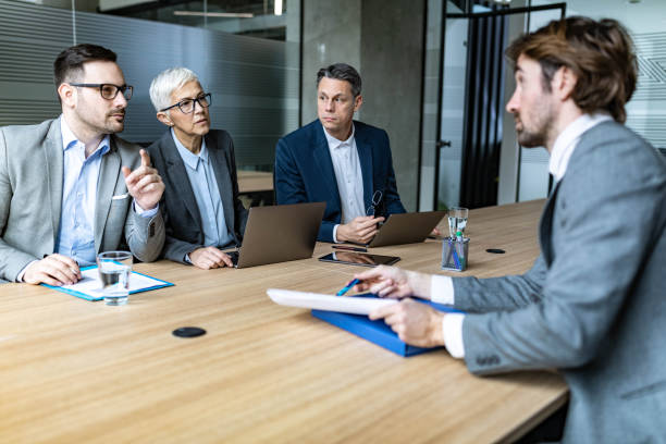 istock Human resource team talking to male candidate on a job interview. 1220125030