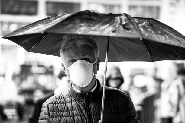 istock Senior man wearing protective face mask outdoors in the city 1220125441