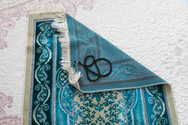 istock Prayer rugs on a carpet in a house, 1220128724