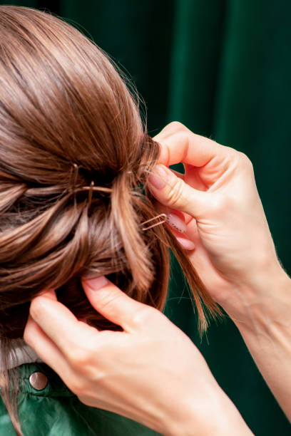 istock Hairdresser making hairstyle. 1220129788