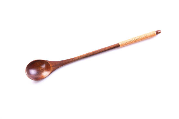 istock wooden spoon isolated on white background. 1220134620