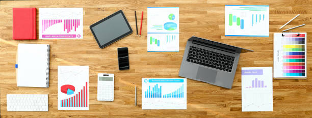 istock Paper with business chart on wooden office table 1220135315