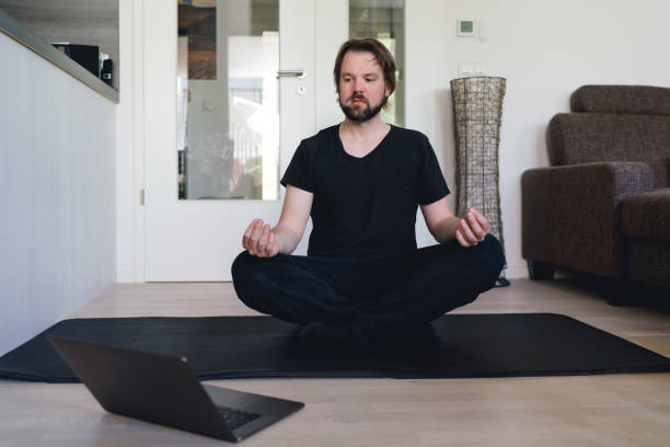 istock Yoga meditation at home with online course 1220137664