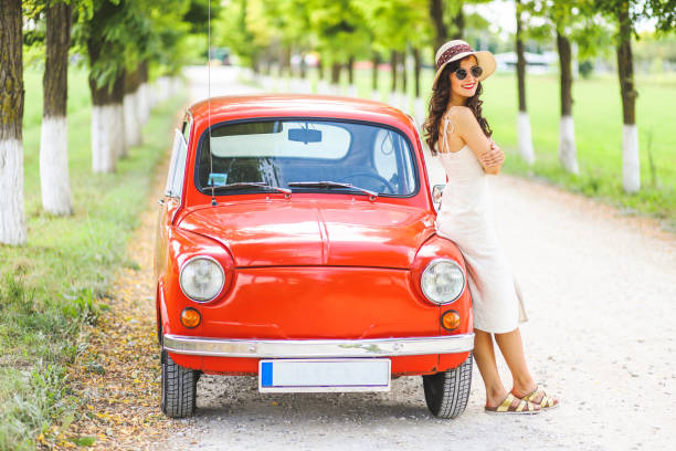 istock Woman and her vintage car 1220138975