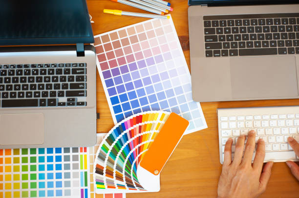 istock Designers are working on laptops on work desks. 1220139362