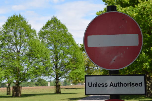 istock No Entry Unless Authorised Road Sign in a Park 1220139891