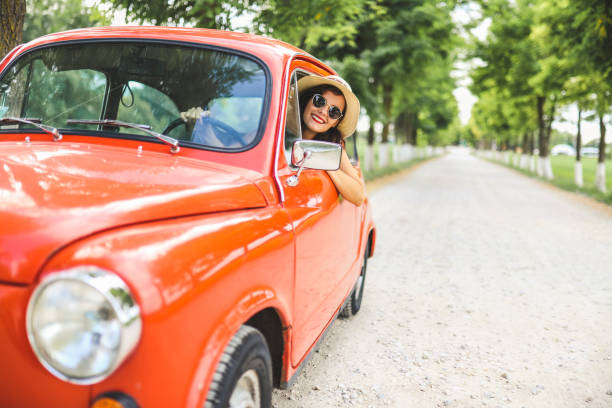 Woman driving vintage car