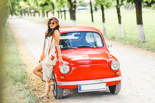 istock Woman and her vintage car 1220140191