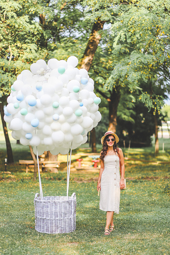 Young fashion woman and hot air balloon decoration