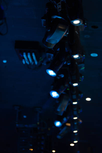 istock stage light with colored spotlights and smoke 1220143605