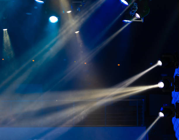 istock lights spotlights and smoke over the stage 1220144423