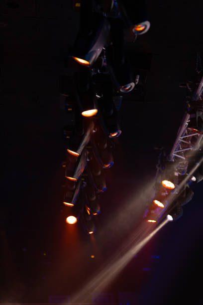 istock lights spotlights and smoke over the stage 1220144459