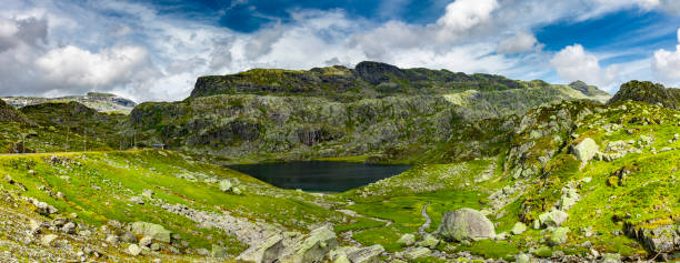 istock Mountain lake in the Norwegian countryside 1220145695
