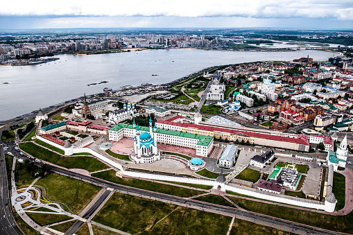 Drone point of view of Volga River and Kremlin with it's white walls in Kazan, Republic of Tatarstan's capital city, Russia.