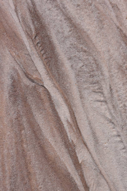 istock Beige and brown hues in diagonally eroded sand 1220145964