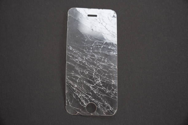 istock broken smartphone safety glass in black background 1220146013